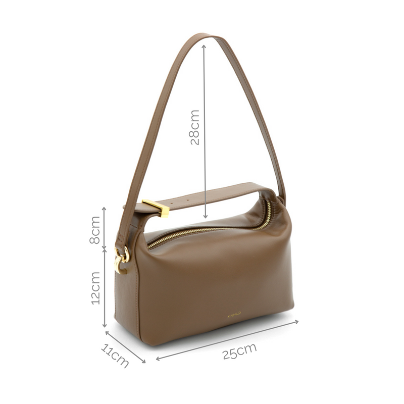 X NIHILO Pillow top handle leather crossbody bag. Crafted in soft calf leather presents a top handle and clasp, with detachable shoulder strap - a classic for any occasion.