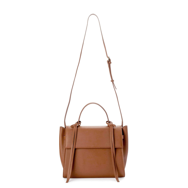 Front view of rectangle genuine tan leather work bag and handbag with leather tassels, front flap and handle, tan leather bag strap extended to the top.