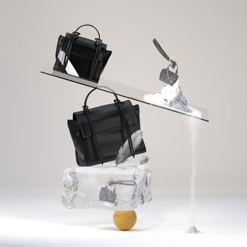 3D animation of X NIHILO Bank Black and Bank Mini bag in black and white, balancing on a ball with miscellaneous items including bank keyring in gunmetal,