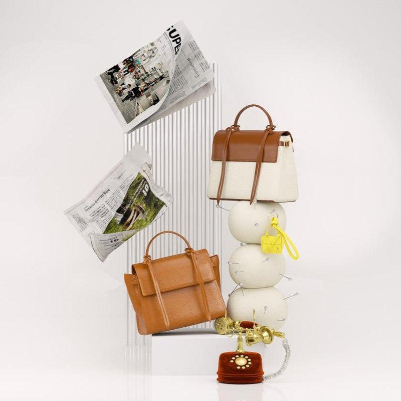 3D animation of X NIHILO Bank Tan and Bank Canvas Tan, genuine cow nappa leather bags, with old style telephone and newspaper sheets.
