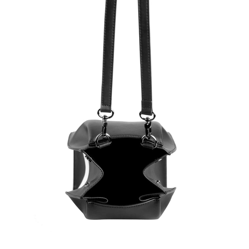 View of opened hybrid mini bucket bag in black with white stripe, genuine nappa leather, with gunmetal hardware, detachable and adjustable strap, two press-stud on sides of the top opening.