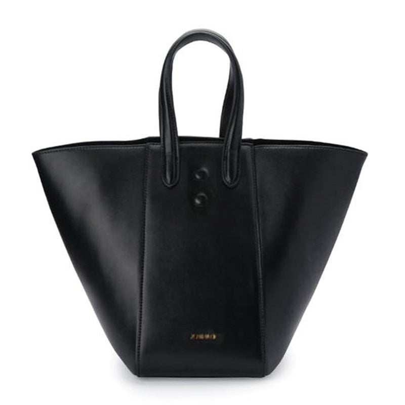 Large black luxury leather tote bucket bag, genuine nappa leather bag with handle and logo X NIIHILO embossed in gold on the bottom front.