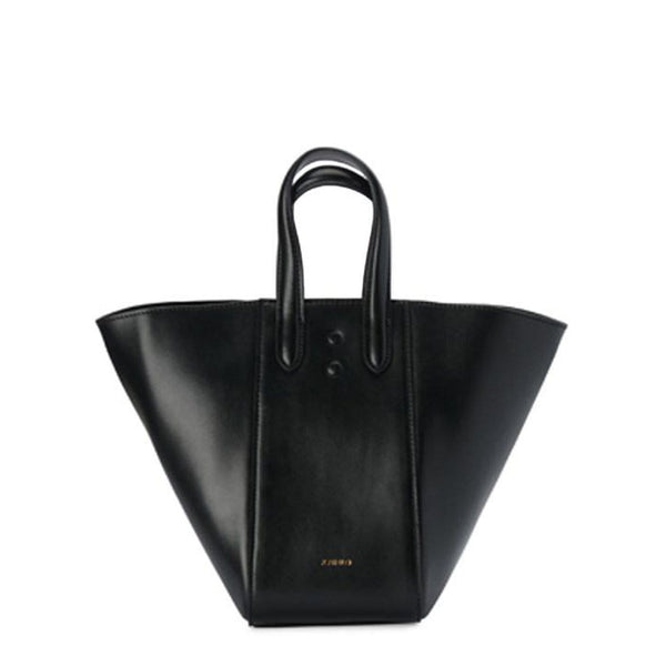 Mini black leather tote bucket bag, genuine nappa leather bag with handle and logo X NIIHILO embossed in gold on the bottom front.