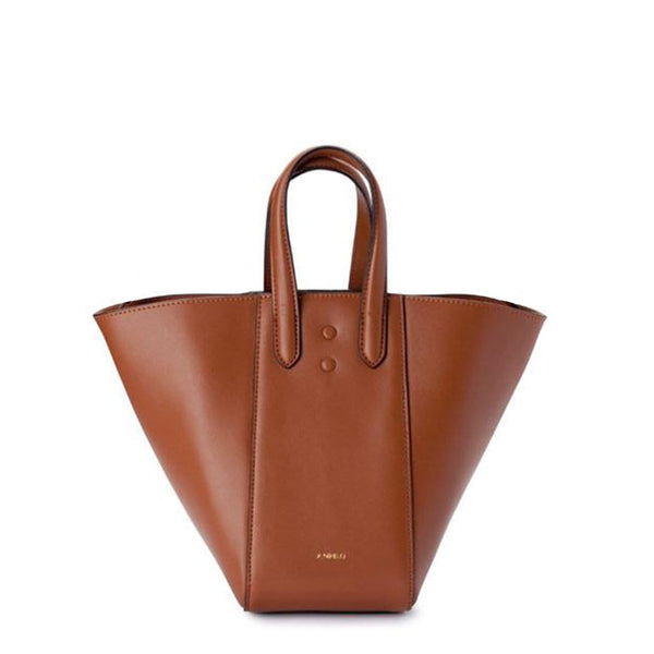 Mini tan leather tote bucket bag, genuine nappa leather bag with handle and logo X NIIHILO embossed in gold on the bottom front.