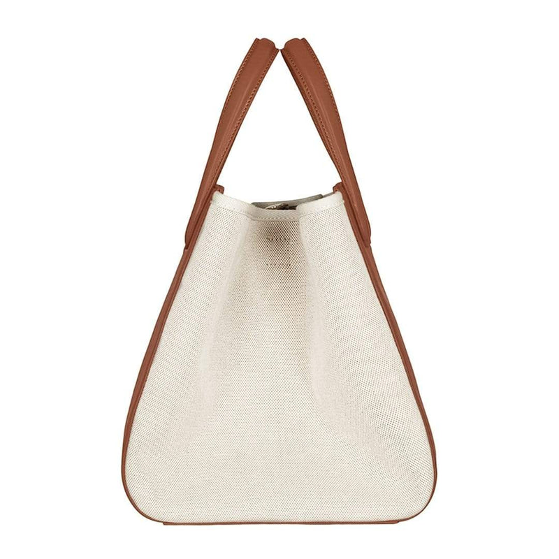 Side view of large tan leather and natural canvas fabric hybrid tote bucket bag, genuine nappa leather bag with handle