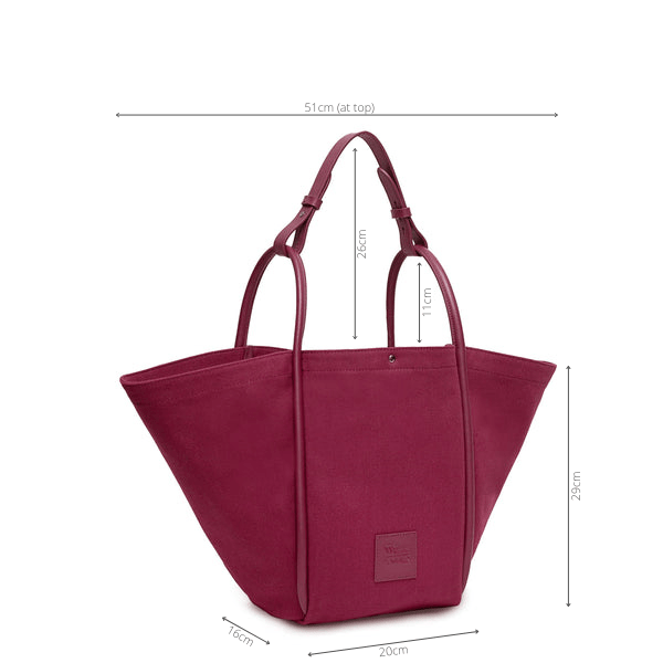 Measurement of burgundy hardwearing canvas bag leather with rolled leather handles. Height 29cm, depth 16cm, width (at top) 51cm, width (at base) 20cm, handle drop 11cm.