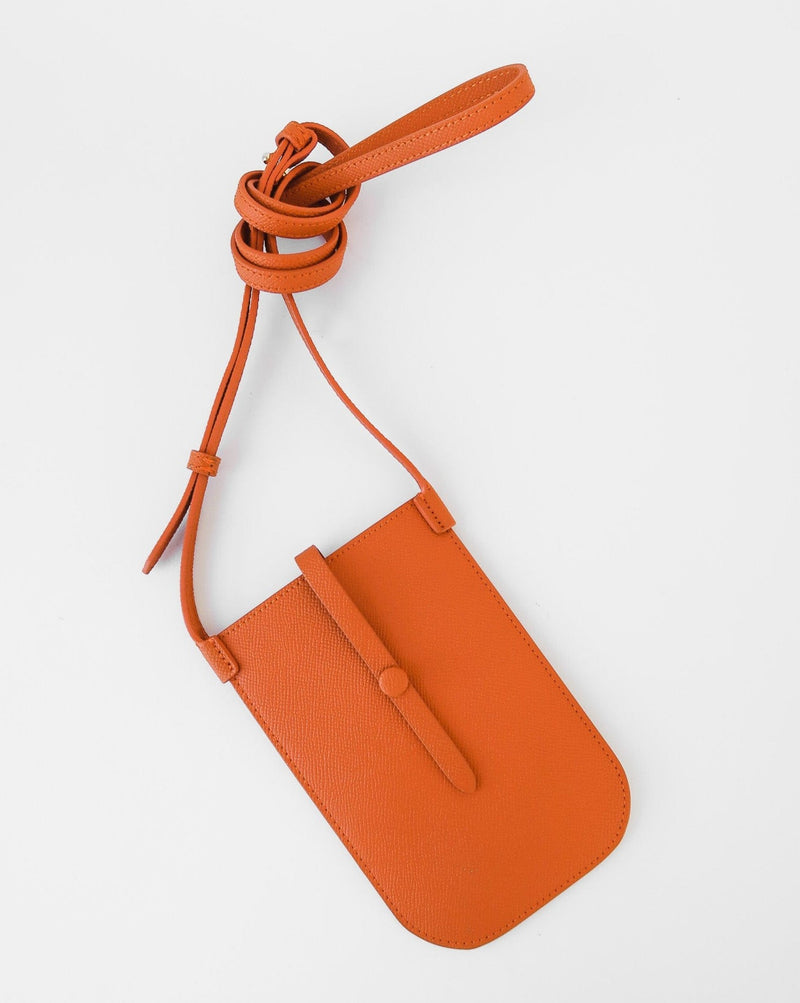 Rectangular Tangerine orange phone pouch with opening on top and an attached shoulder strap against white background