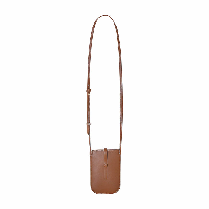 Rectangular woman's tan phone pouch. White stitching along the edges and an opening for the phone at the top. A sling with a tan button keeps the essentials secured. Shoulder strap extended.