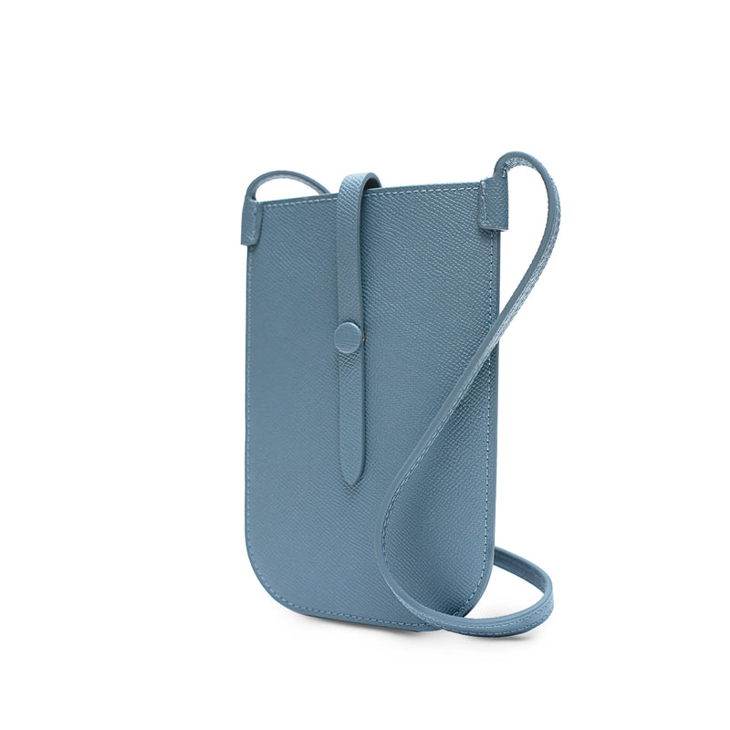 Rectangular Chambray blue phone pouch with opening on top and a attached shoulder strap.