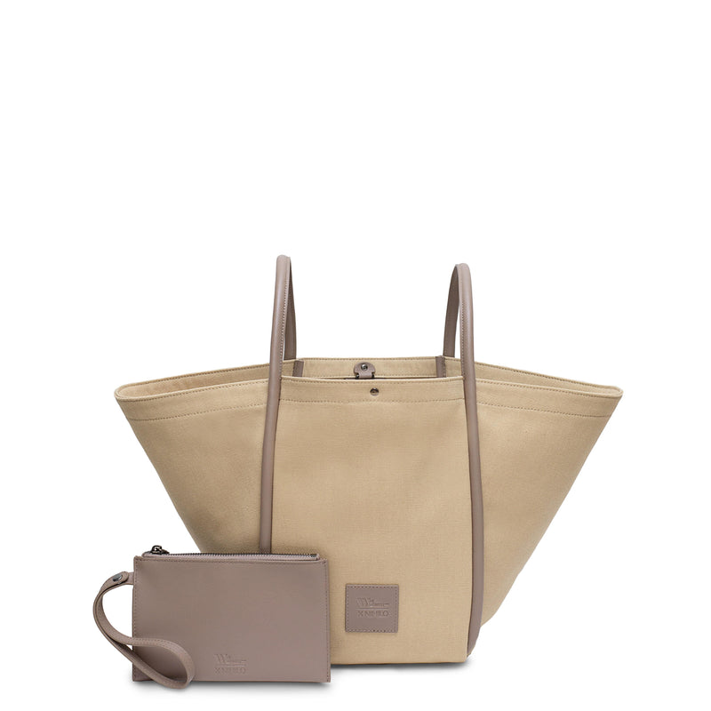 Camel canvas tote bucket bag, with camel rolled leather handles, silver button closure at the top and small square logo of WEST14TH and X NIHILO. Small camel leather pouch shown in front with hand strap.