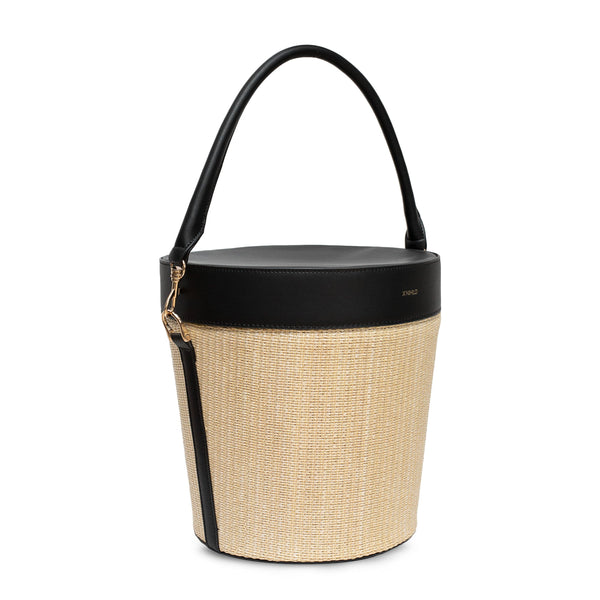 Raffia picnic basket with black leather top and detachable leather handle. Gold logo embossed on the top with soft gold hardware on the sides.