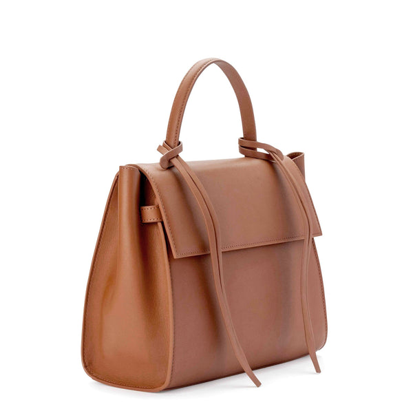 Angled side view of rectangle genuine tan cow nappa leather work bag and handbag with leather tassels, front flap and handle.