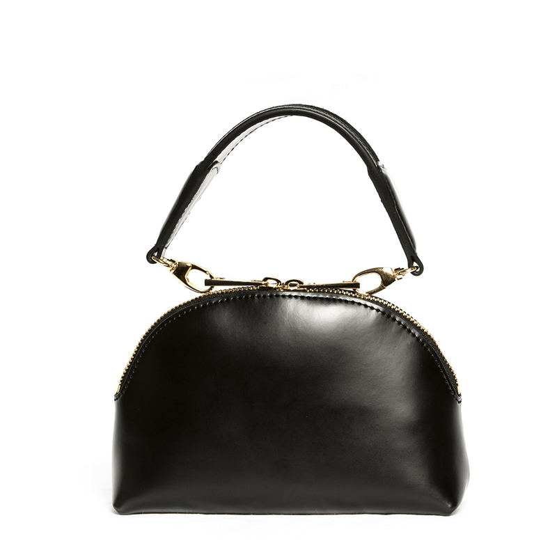 X NIHILO Stella in black with soft gold hardware, fashion bag with zip top closure and removable handle, luxury black box leather with pony hair (cowhide) handbag, genuine leather bag