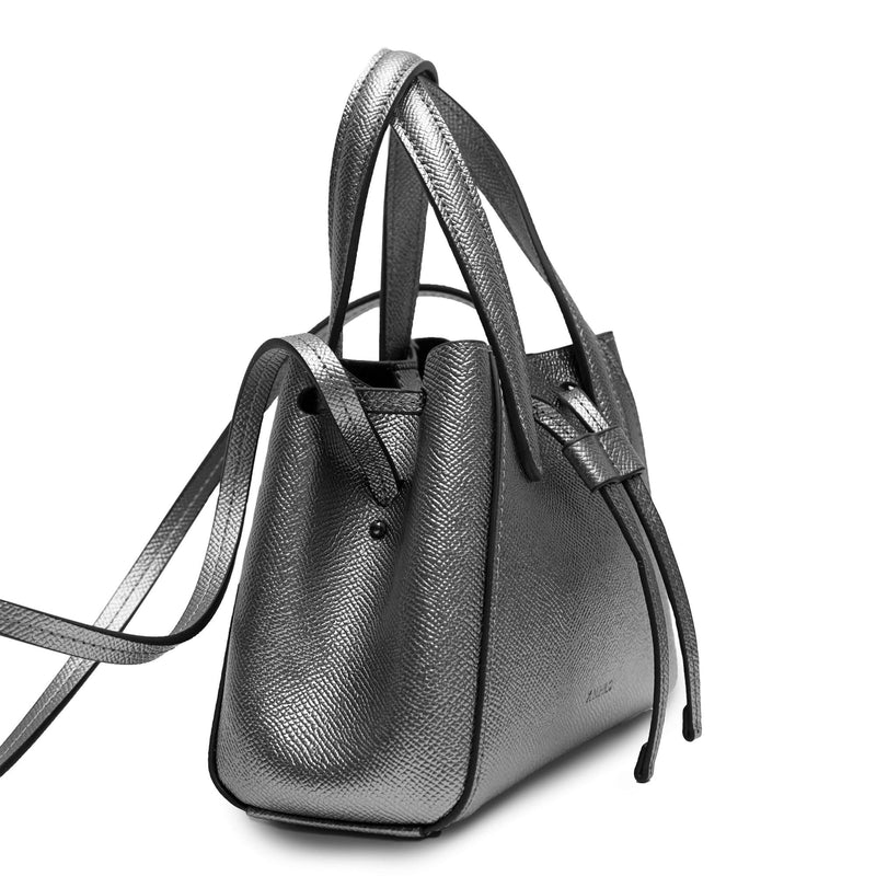 Side view of Mini genuine gunmetal leather bucket shape crossbody bag with handles and leather pull-strings, X NIHILO Aria bag, textured cow leather with silver hardware, fashion bag