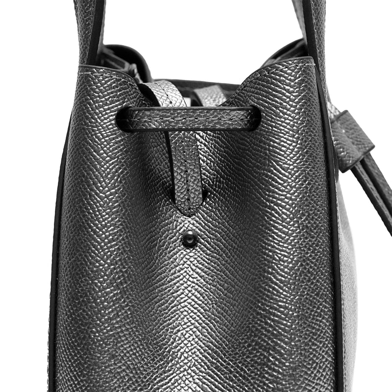 Close up of Mini genuine gunmetal leather bucket shape crossbody bag with handles and leather pull-strings, X NIHILO Aria bag, textured cow leather with silver hardware, fashion bag