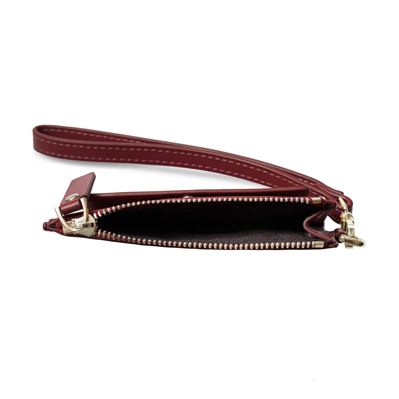Zipped open view of small red genuine cow nappa eather coin purse and wallet with leather strap and metal hardware.